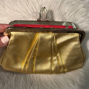 Christian Louboutin Gold Clutch with Red Accent